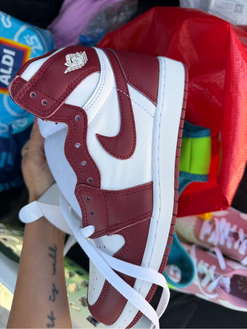 Jordan Women’s High-Top Sneaker in White and Burgundy